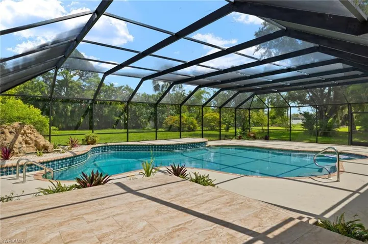 Outdoor pool featuring a patio area and a lanai