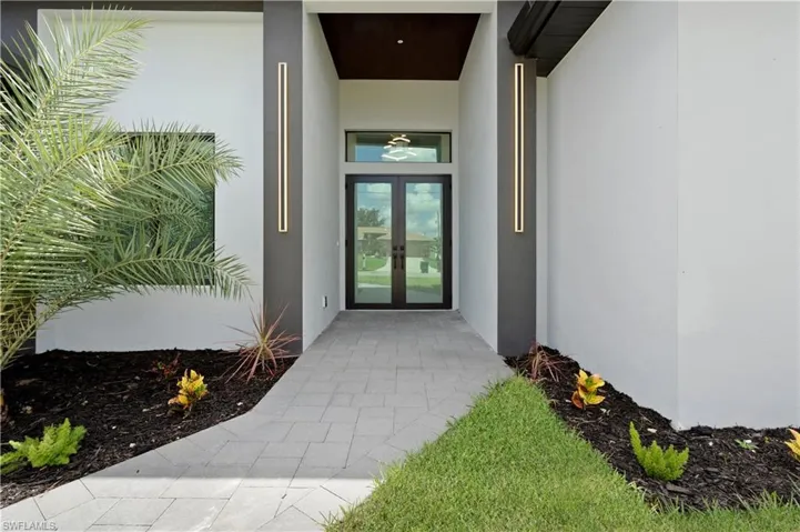 Doorway to property featuring french doors