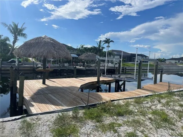 Dock area featuring a water view and boat lift