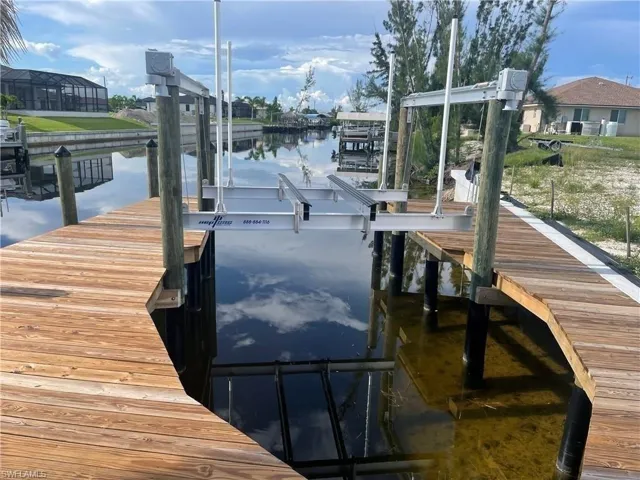 Dock featuring a water view and boat lift