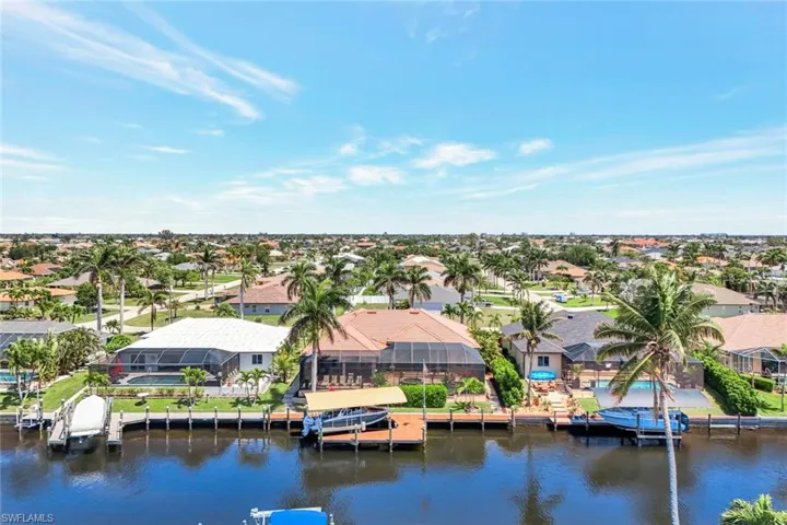 Aerial view of residential area with a nearby body of water