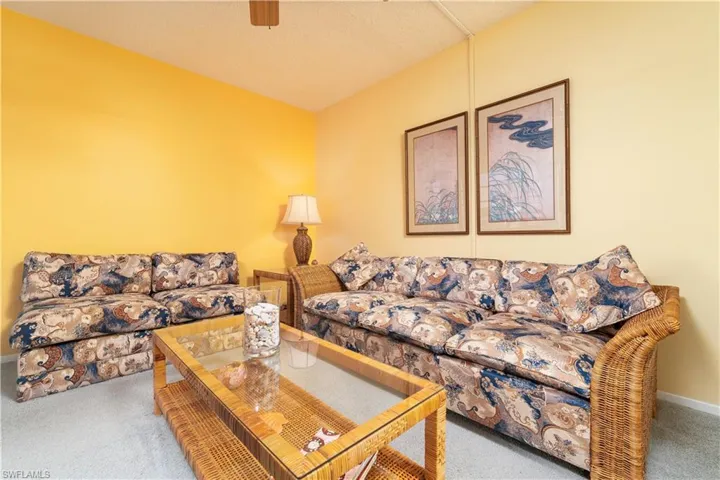 Living room with a textured ceiling and carpet