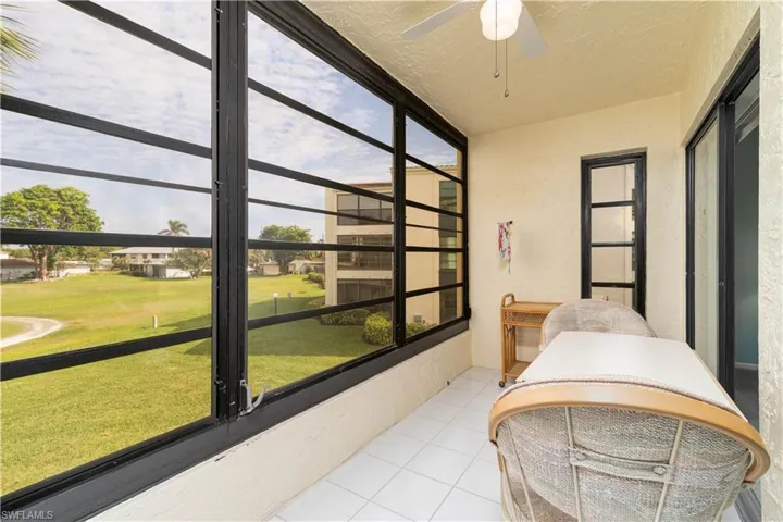 Sunroom featuring ceiling fan