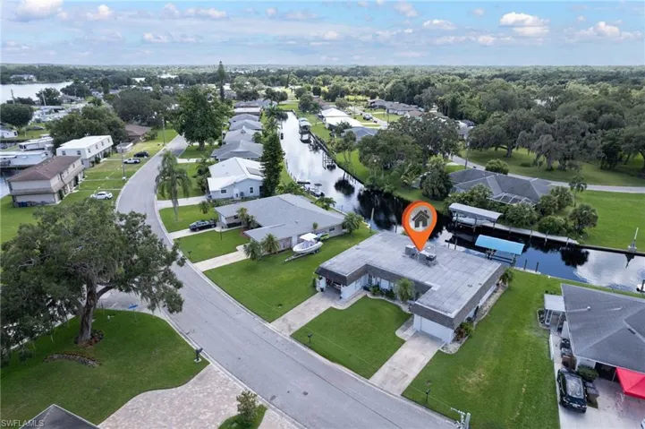View of property location with nearby suburban area and a nearby body of water