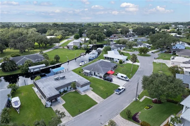 Aerial overview of property's location with nearby suburban area