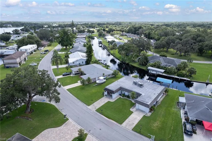 View of property location with nearby suburban area and a nearby body of water