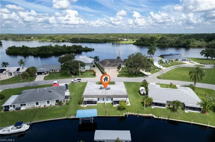 Aerial perspective of suburban area with a large body of water