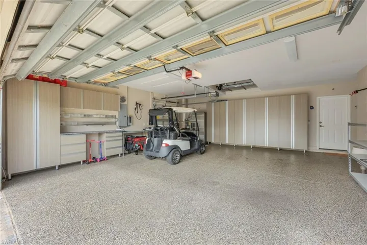 Garage featuring a garage door opener