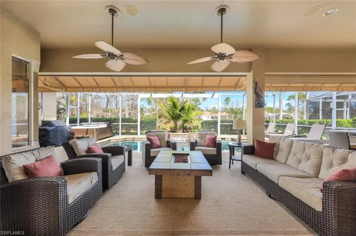 Sunroom / solarium featuring ceiling fan