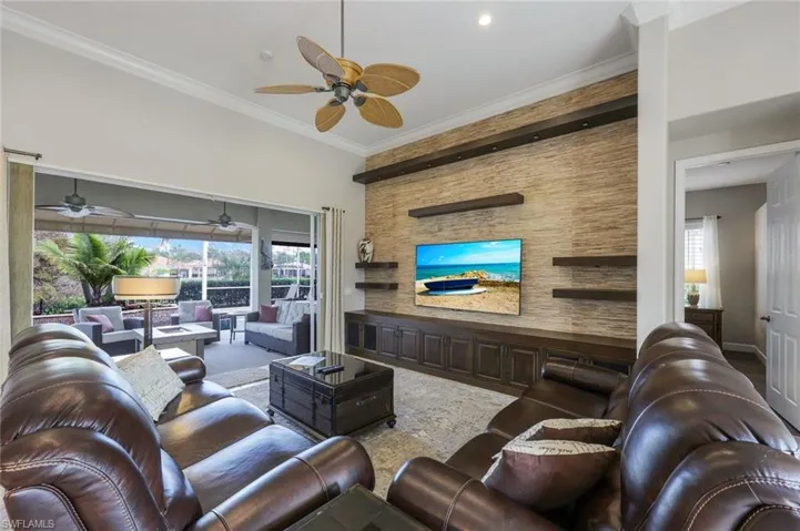 Living room featuring crown molding