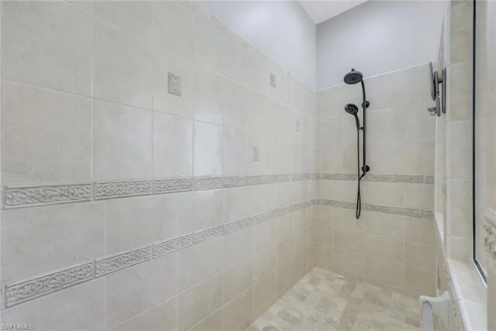 Bathroom featuring a tile shower