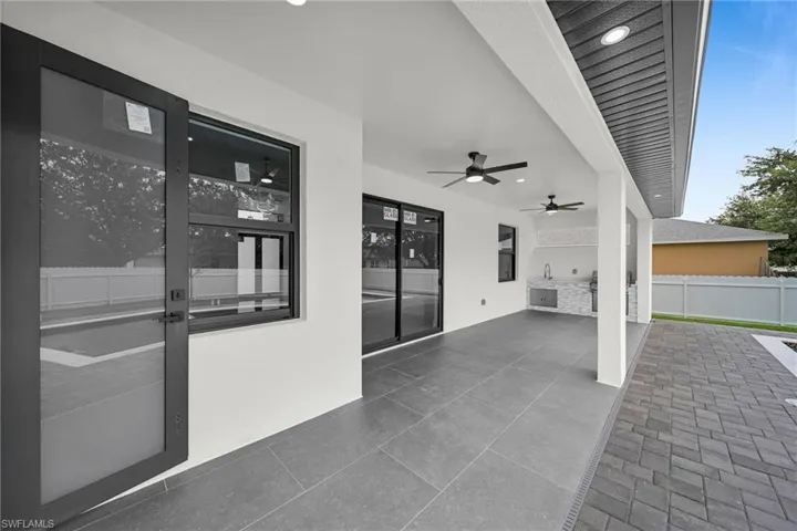 View of patio featuring ceiling fan