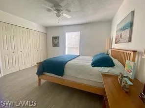 Bedroom featuring ceiling fan and hardwood / wood-style floors