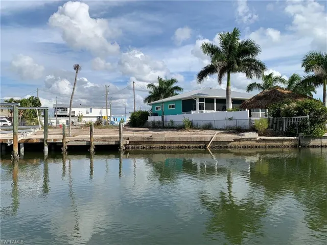 View from canal towards two lots.