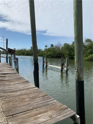 Dock featuring a water view down Cherry Canal.