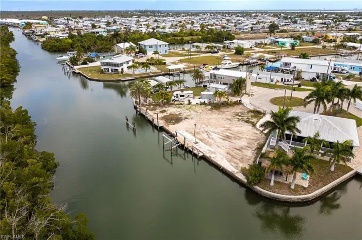 Aerial view of residential area with a view of canal and seawall area