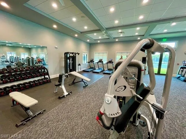 Workout area featuring a drop ceiling