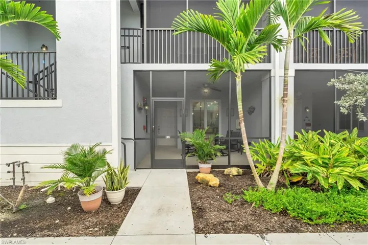 Property entrance featuring a balcony and french doors