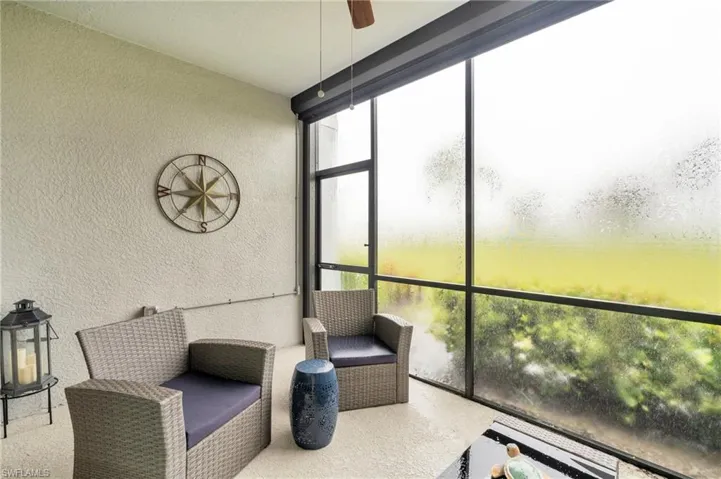 Sunroom featuring ceiling fan