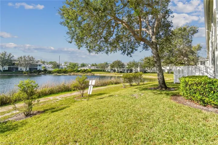 View of yard with a water view