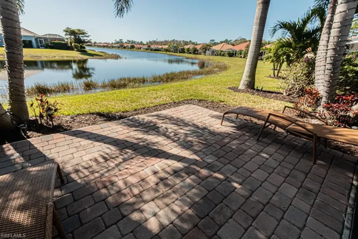 View of patio with a water view