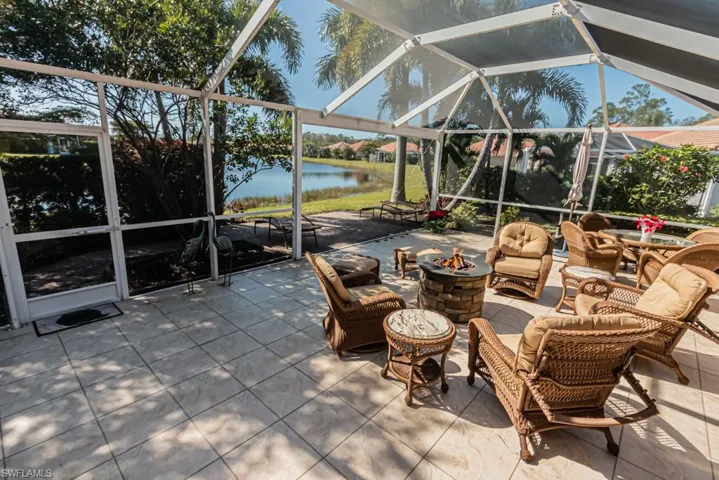 View of patio / terrace featuring a water view and a lanai