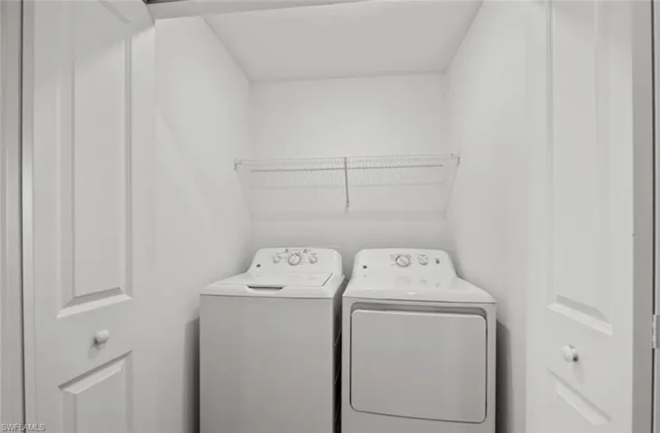 Laundry room featuring washing machine and dryer and laundry area