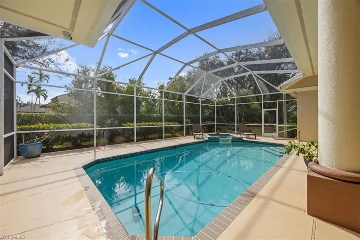 View of pool featuring a lanai and a patio area