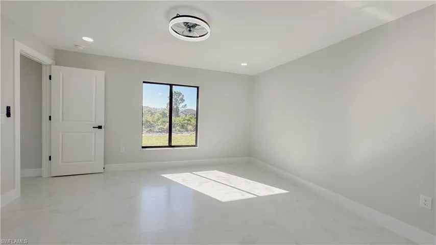 Spare room featuring light tile patterned floors