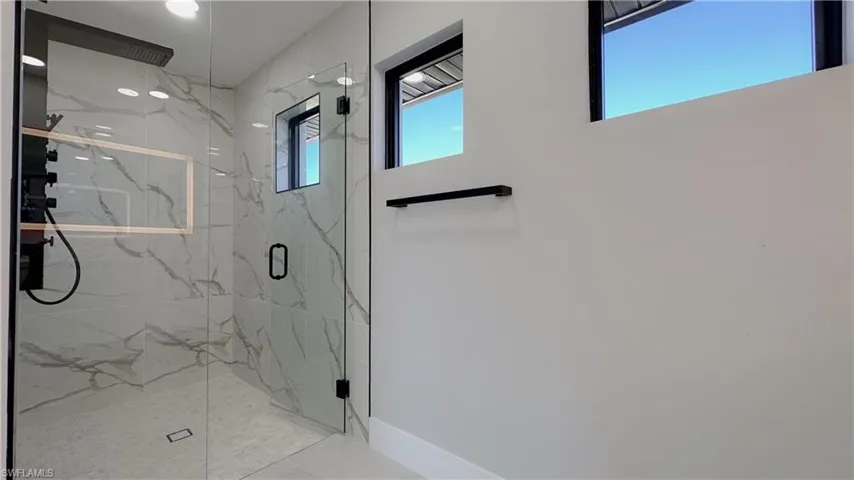 Bathroom with a shower with door