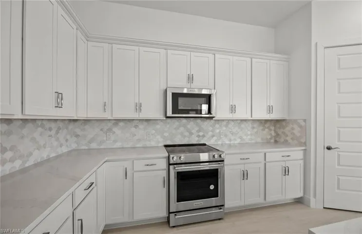 Quartz countertops, stylish backsplash,