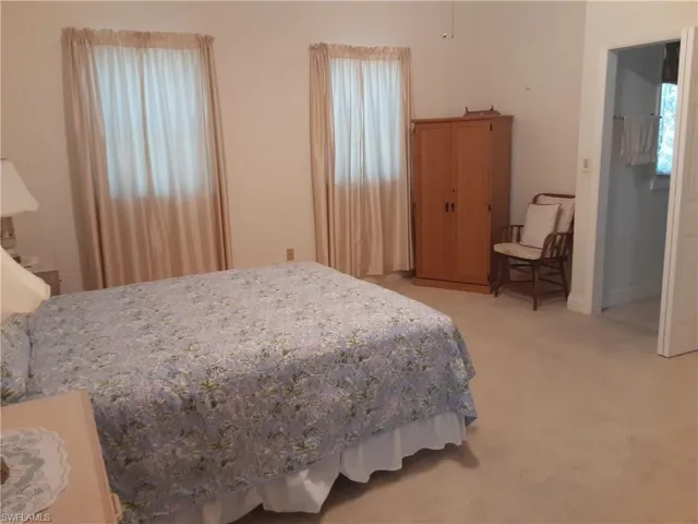 Master bedroom #2 with light carpet