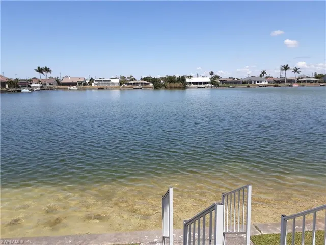 Water view with nearby suburban area