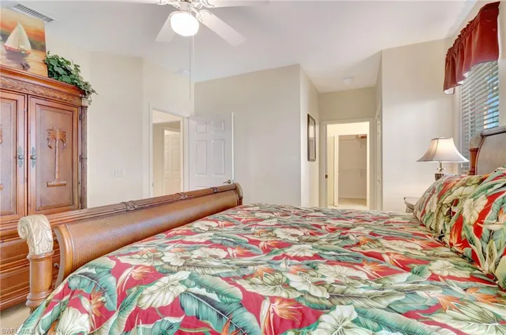 Bedroom with ceiling fan and visible vents