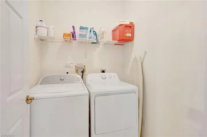 Laundry room with washer and dryer and laundry area