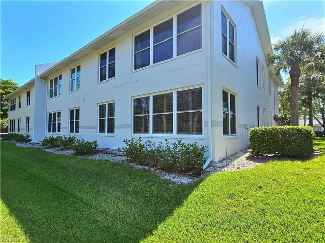 Entrance to property featuring stucco siding