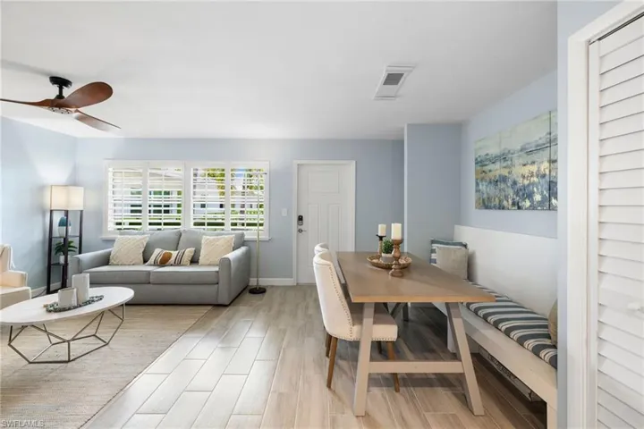 Dining area featuring light wood-type flooring and ceiling fan