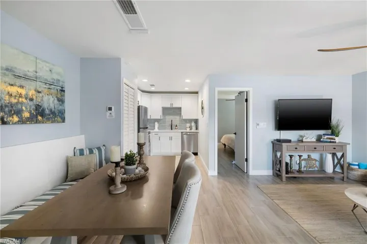 Dining area with recessed lighting, a ceiling fan, and light wood-style floors