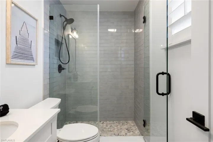 Full bath featuring vanity and a stall shower