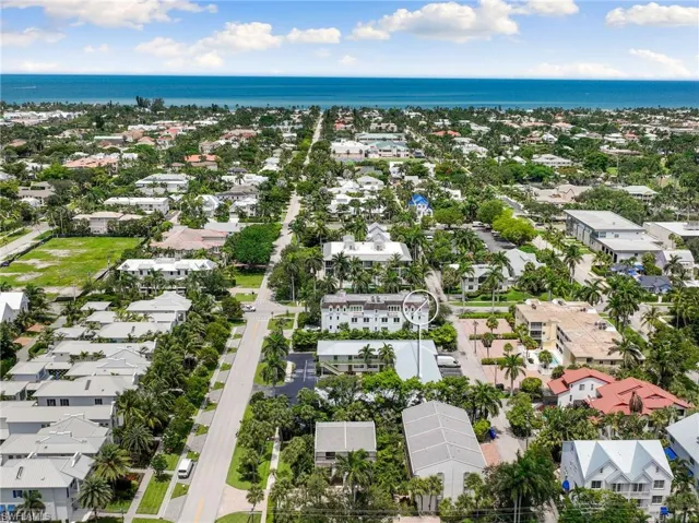 Aerial perspective of suburban area with a nearby body of water