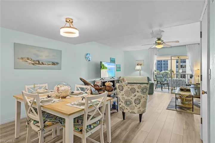 Dining area featuring light wood-style floors and a ceiling fan