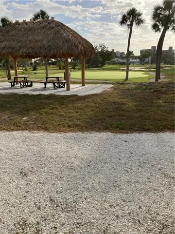 View of home's community with a patio area and a yard