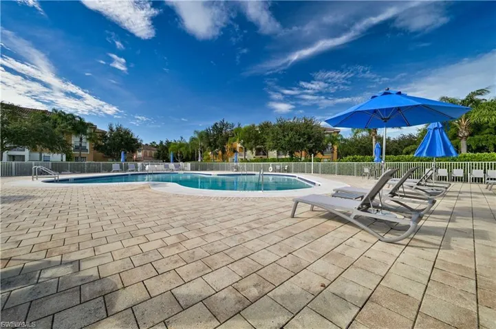 Community pool featuring a patio area