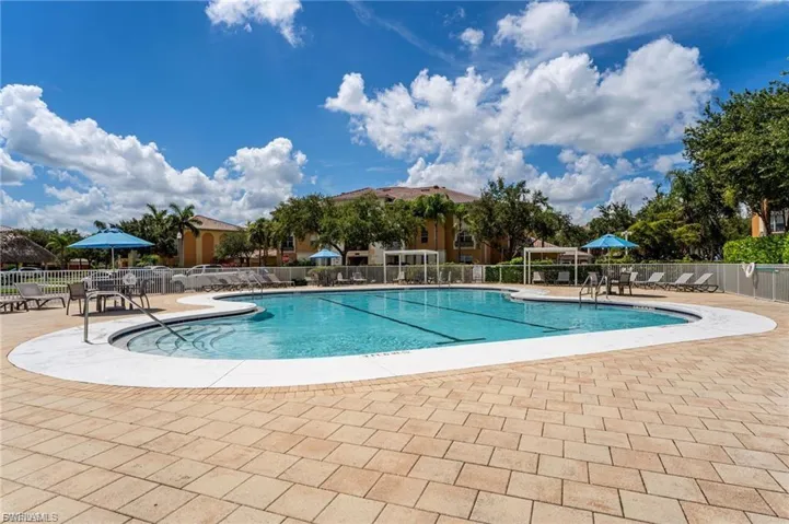 Community pool featuring a patio