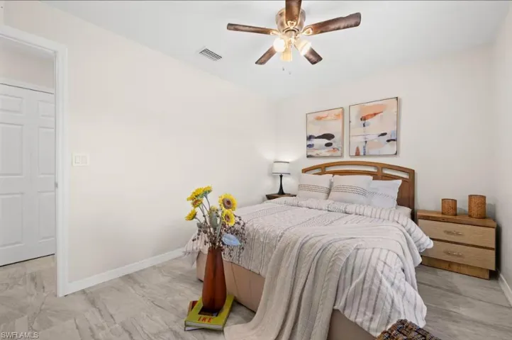 Bedroom featuring baseboards and a ceiling fan