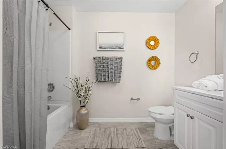 Full bath with vanity and shower / tub combo with curtain