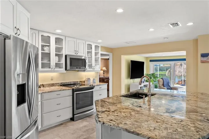 Oversized Granite Island makes a great Gathering Place