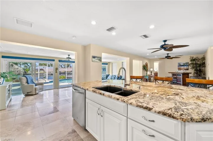 A view from the Kitchen to the Pool and Canal