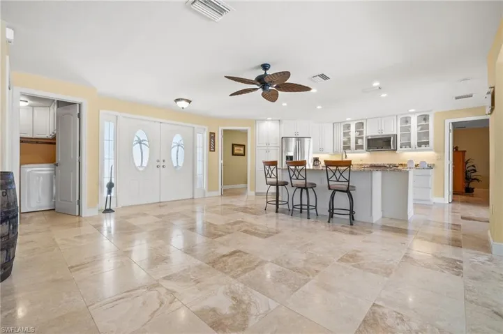 View of the Entryway with Double Doors and Skylights