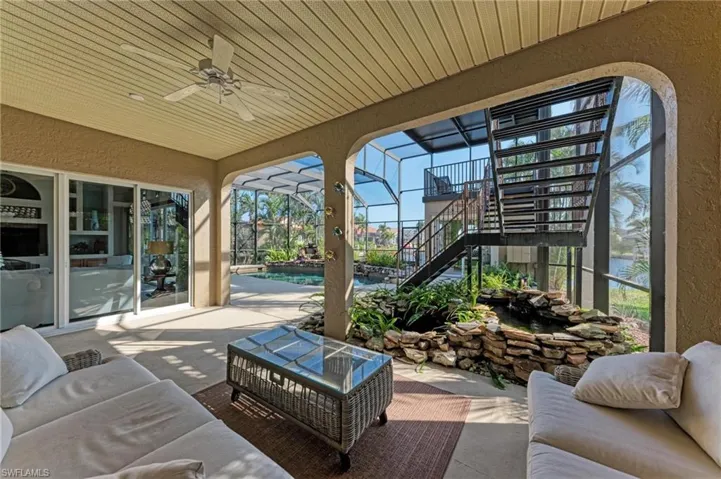 View of patio / terrace featuring outdoor lounge area, ceiling fan, and a lanai